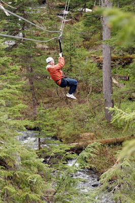 Ziplining over hills and trees near Juneau, Alaska.