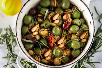 Warm Marinated Olives with Lemon Zest, Rosemary, Garlic and Almonds