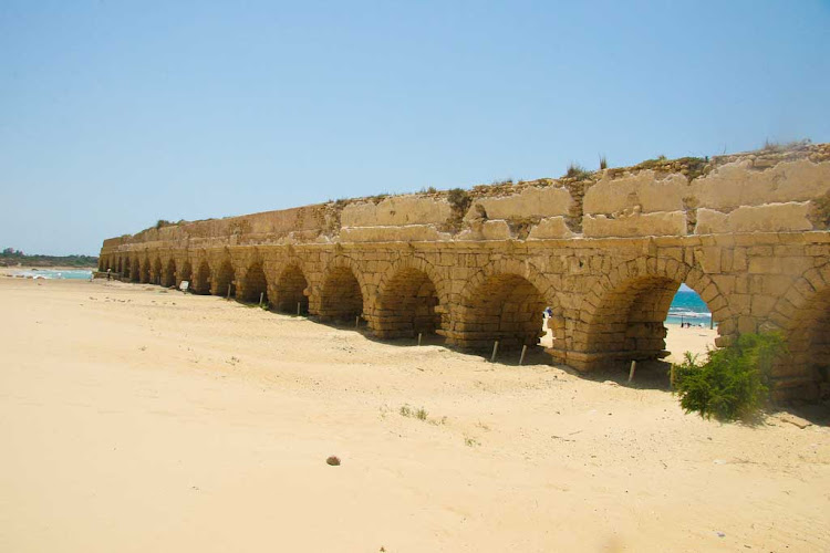 Ruins of the aqueduct, dating from Roman times, in Caesarea National Park, Israel