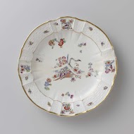 Rond bord, veelkleurig beschilderd met een Kakiemon-decor