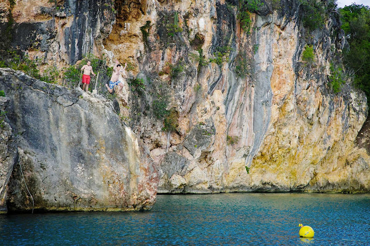 Diving into the water from Little Bay Rock in Anguilla. Little Rock is a great, secluded spot for swimming and snorkeling.