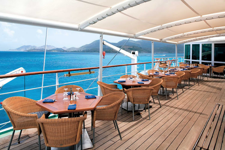Dine al fresco at Veranda, an ideal mid-ship dining area for enjoying breakfast and lunch aboard Windstar Cruises' Wind Surf.