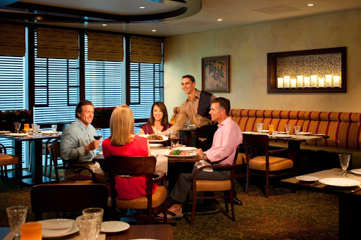 Dine in a casual, comfortable setting at Giovanni's Table, an Italian restaurant that serves family-style dishes at lunch ($15) and dinner ($20) on Grandeur of the Seas.