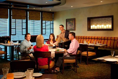 Dine in a casual, comfortable setting at Giovanni's Table, an Italian restaurant that serves family-style dishes at lunch ($15) and dinner ($20) on Grandeur of the Seas.