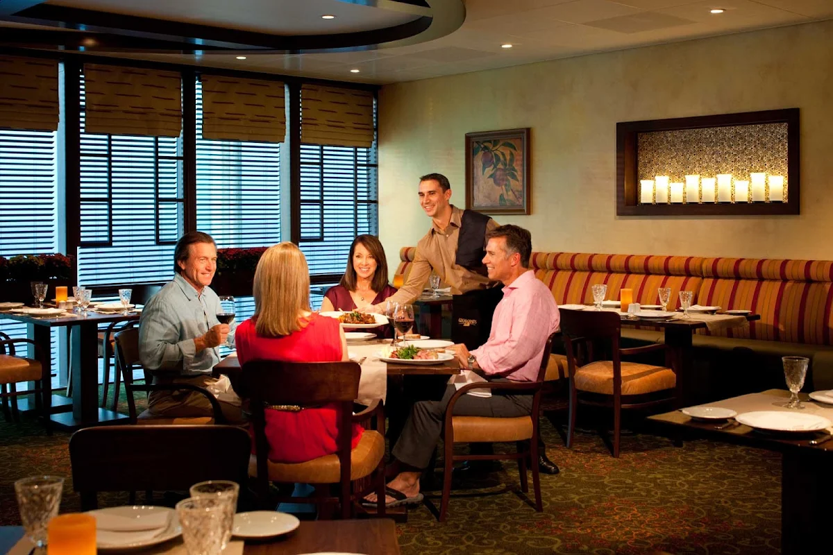 Grandeur-of-the-Seas-Giovannis-dining - Dine in a casual, comfortable setting at Giovanni's Table, an Italian restaurant that serves family-style dishes at lunch ($15) and dinner ($20) on Grandeur of the Seas.