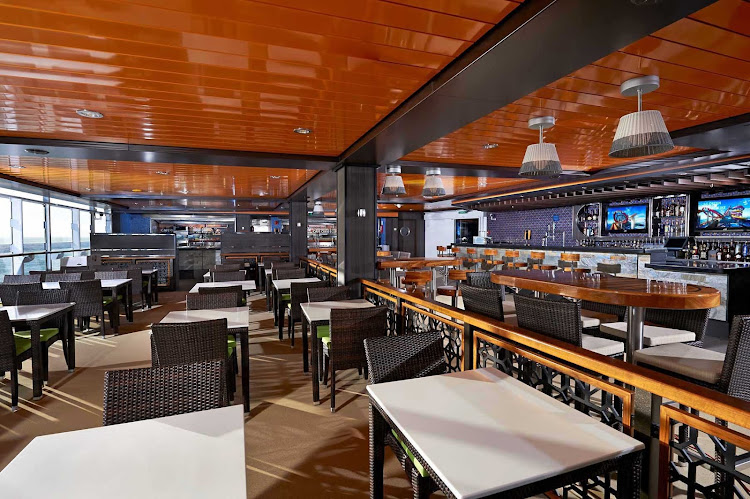 Sip your favorite drink or have a savory bite at the Flamingo Bar & Grill aboard a Norwegian Getaway cruise.