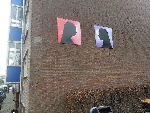 Red and Purple Profiles on House Wall 