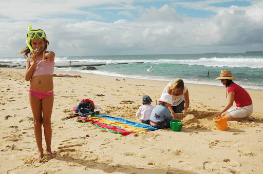 A family having fun at Bar Beach in the Newcastle
region of North Coast NSW, Australia.