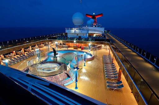 Take a night swim in the Sirens Pool, one of four swimming pools on Carnival Miracle.
