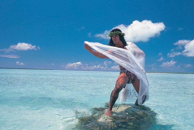 A local man fishes in the Tuamotu atolls of Rangiroa. 