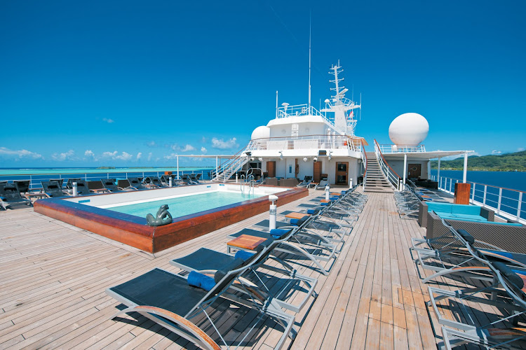 The pool deck aboard the Paul Gauguin offers sweeping views, ample seating and a pool bar.