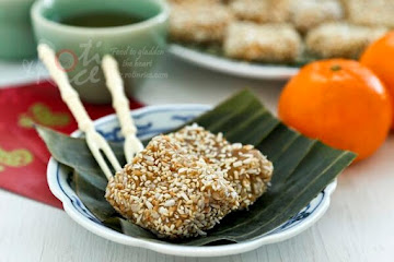Steamed Nian Gao with Grated Coconut and Sesame Seeds