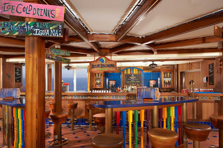Relax with a drink in the Blue Iguana Bar when you sail on Carnival Breeze. 
