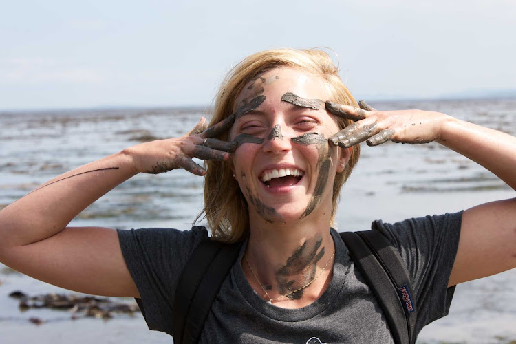 A woman hiker gets a little closer to nature in Bas-Saint-Laurent, Quebec, Canada