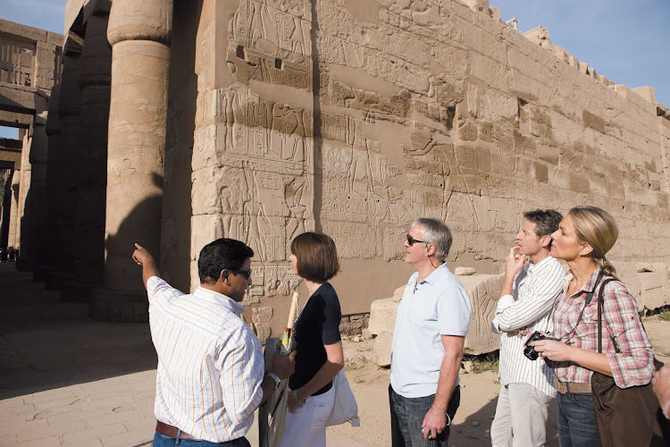 Experienced guides will lead you through the historic Karnak Temple complex during your Egyptian adventure on Uniworld's River Tosca cruise ship. 