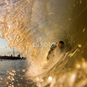 Joey tucking into a small barrel by Dave Nilsen - Sports & Fitness Surfing
