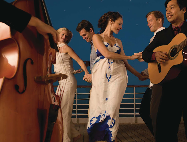 Sway to the music and feel the sea breeze while dancing on the deck of Seabourn Sojourn.