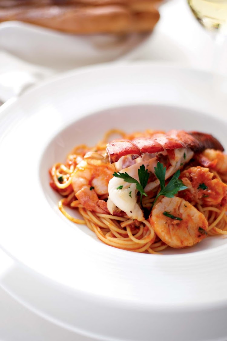 Indulge on lobster pasta during your Crystal Serenity voyage.