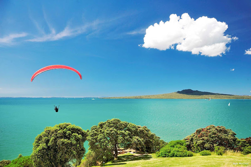 A parasailer explores the islands of Auckland’s Hauraki Gulf Marine Park in New Zealand.