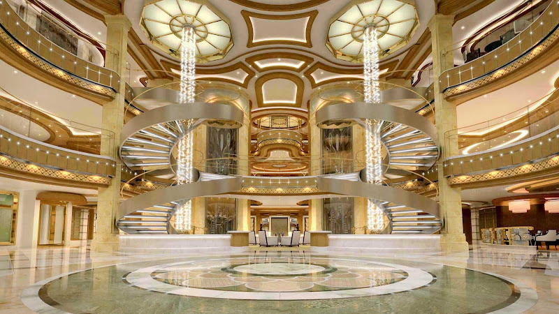 Royal Princess’ large piazza-style atrium, seen from deck 5, features spiral staircases, dining options that include Gelato and the Ocean Terrace Seafood Bar, and live entertainment from the nearby bar or lounge.