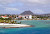 A seaside slice of Oranjestad, Aruba's main port, with the volcanic formation Hooiberg ("Haystack") in the background.