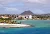A seaside slice of Oranjestad, Aruba's main port, with the volcanic formation Hooiberg ("Haystack") in the background.