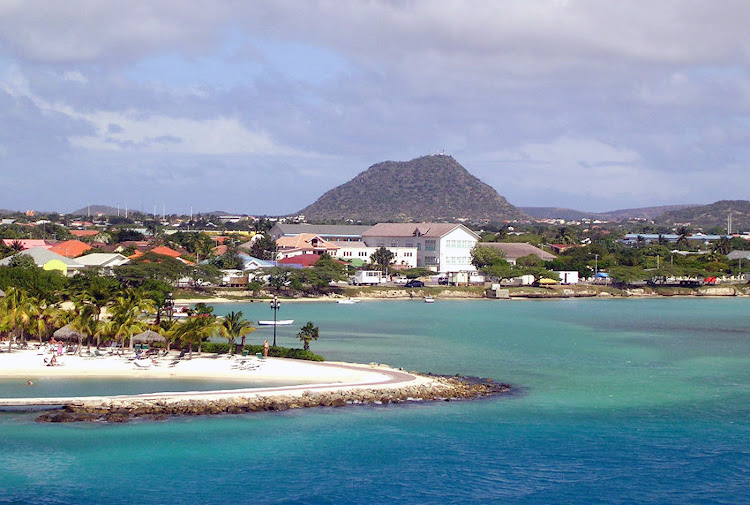 A seaside slice of Oranjestad, Aruba's main port, with the volcanic formation Hooiberg ("Haystack") in the background.