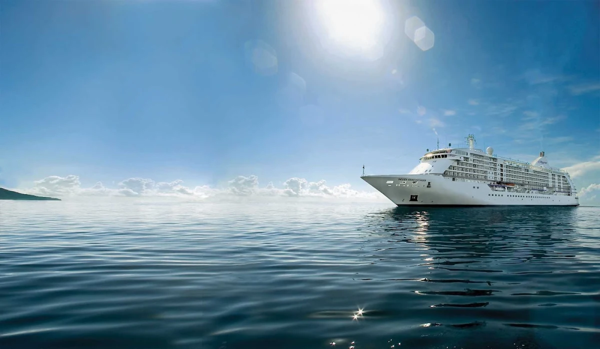 Regent-Seven-Seas-Voyager-at-sea-5 - Regent's Seven Seas Voyager sails during a picture perfect day. Her 447 crew members provide service to no more than 700 guests.