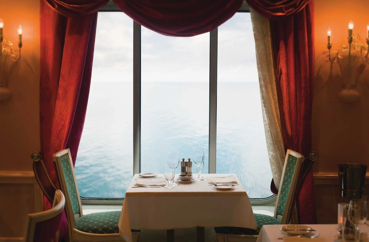 Norwegian-Pearl-Dining-Palace-1 - Sit with your date by the window of Norwegian Pearl's Summer Palace restaurant for perfect ocean views while enjoying your meal.