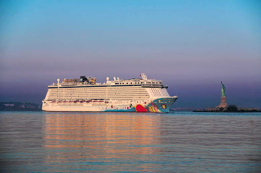 Norwegian-Breakaway-New-York-sunset - Norwegian Breakaway passes the Statue of Liberty at sunset.