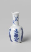 Miniature bottle vase with flowering plants and women