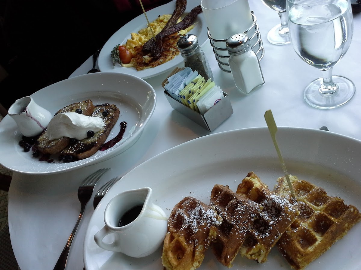 waffles, french toast, hashbrowns eggs and bacon