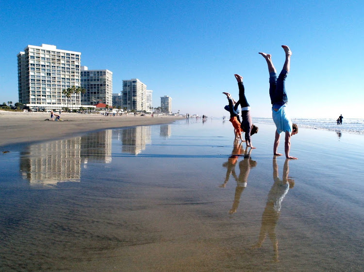 Handstands on the beach at Coronado, California.