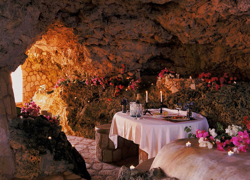 For a memorable dinner, dine at the Caves, an upscale oceanfront gazebo in Negril, Jamaica, with a hand-crafted stone table lit by candlelight.