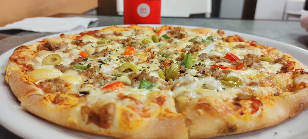 Al Madina Doner Y Pizzeria — Comida y bebida