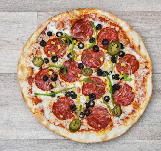 Pizzeria Camilo's taglio — Comida y bebida