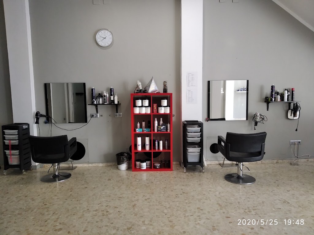 por los pelos jyd peluqueros — Interior