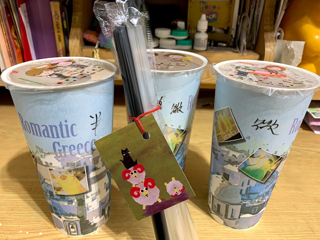 黑貓妞妞插畫創作複合茶飲 的照片