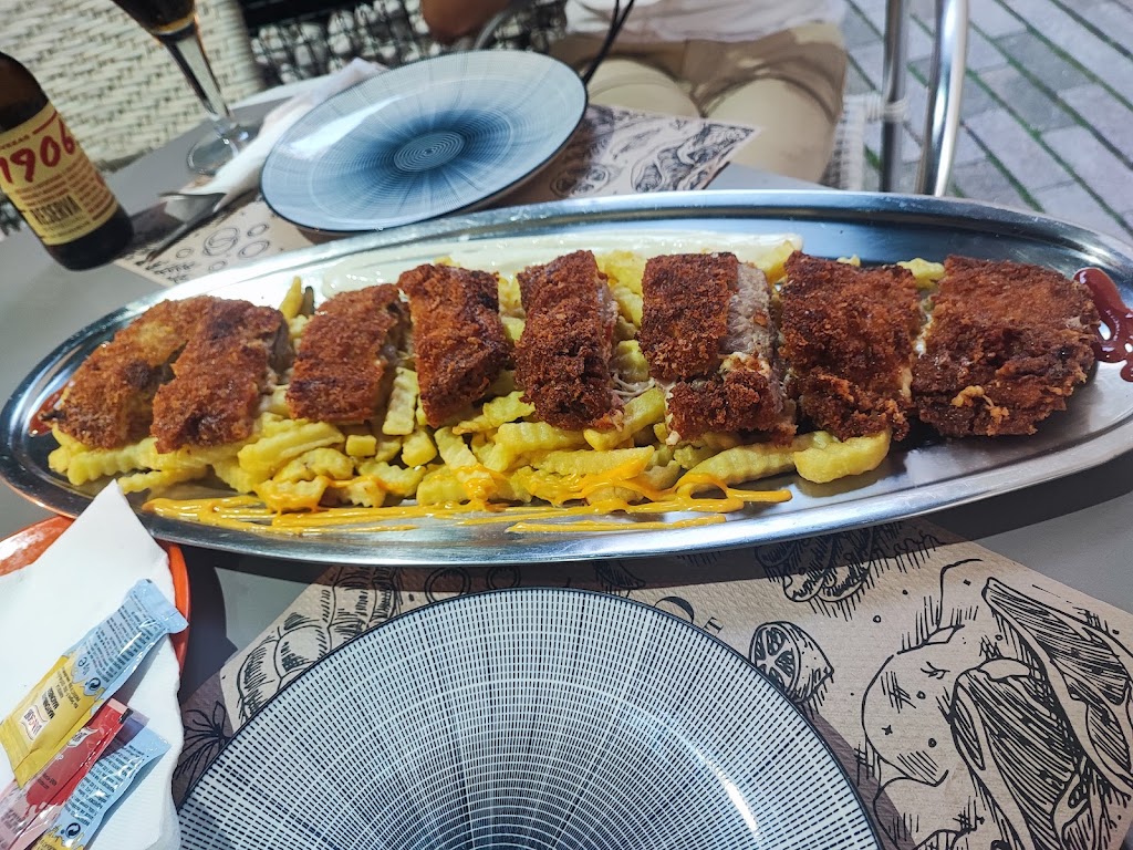 Bar O Tapeo — Comida y bebida