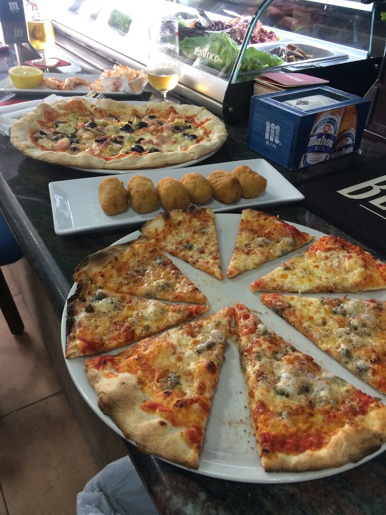Muncho Pizza Taperia — Comida y bebida