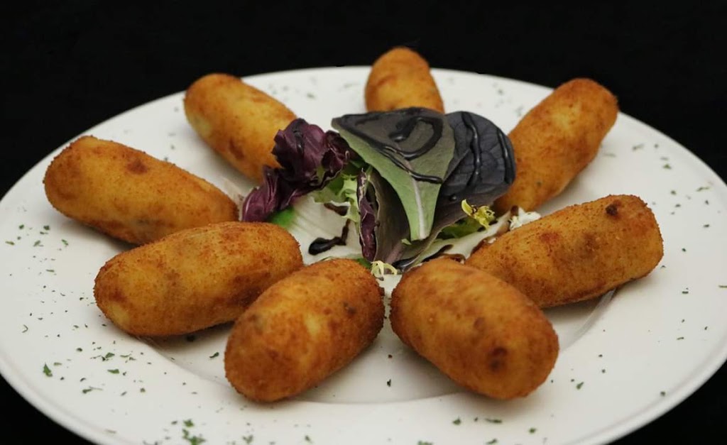 Taberna La Tapita — Comida y bebida