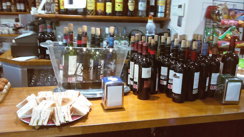 Bodegon Quiroga — Comida y bebida