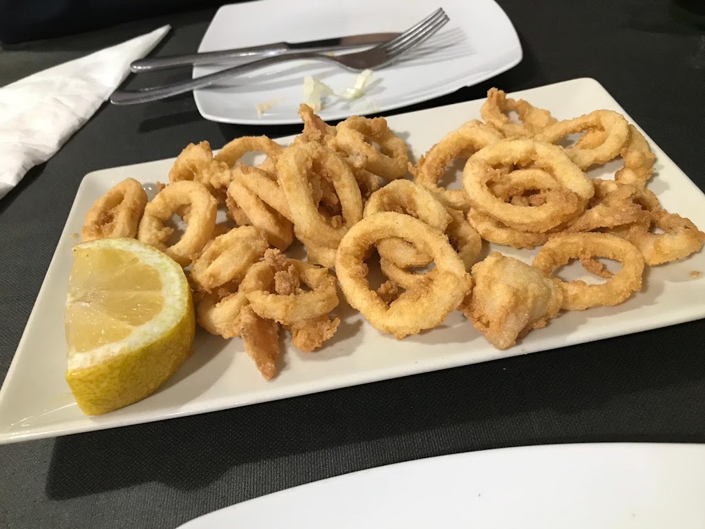 REX Tapas y Vinos — Comida y bebida