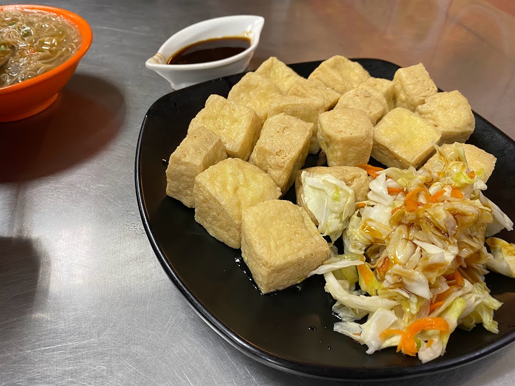 許記 15元油飯、2管麵線、臭豆腐&白白100元快剪 的照片