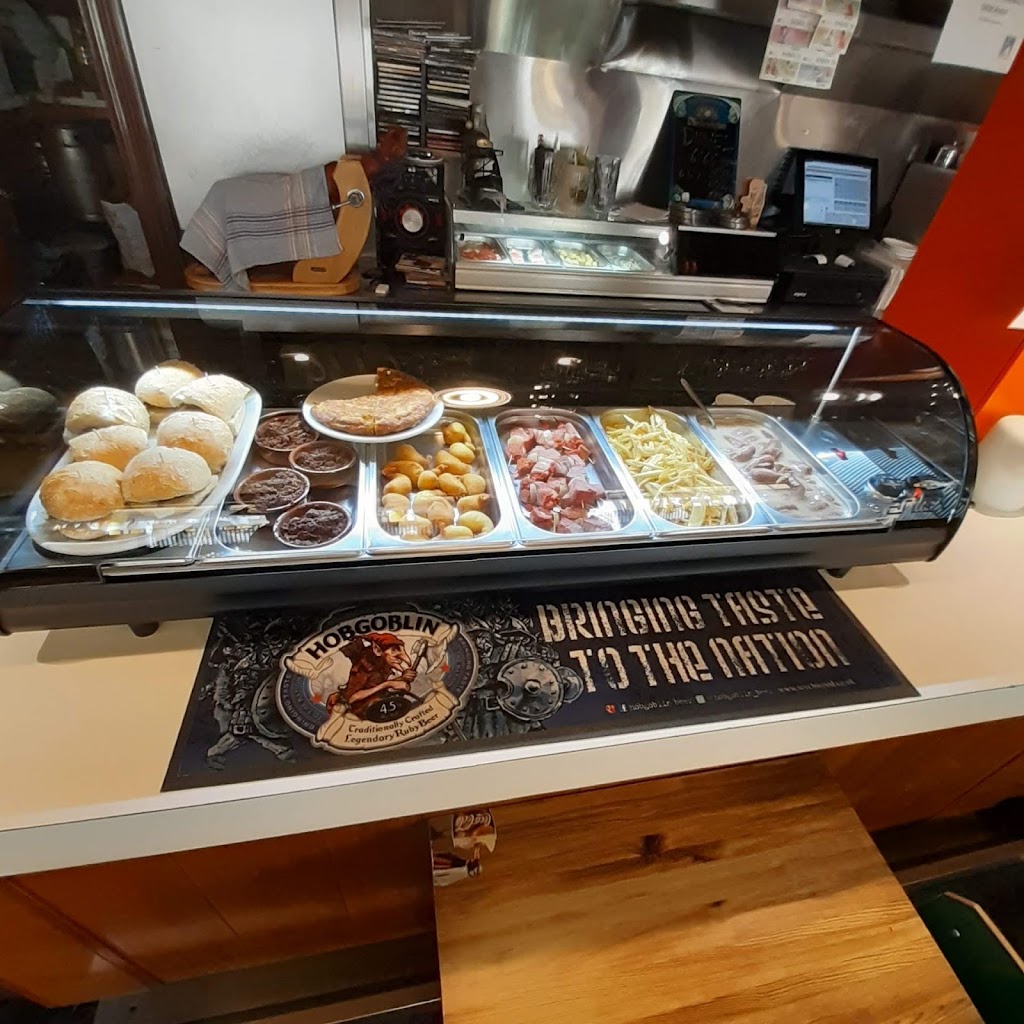 Cerveceria La Ciguena — Comida y bebida