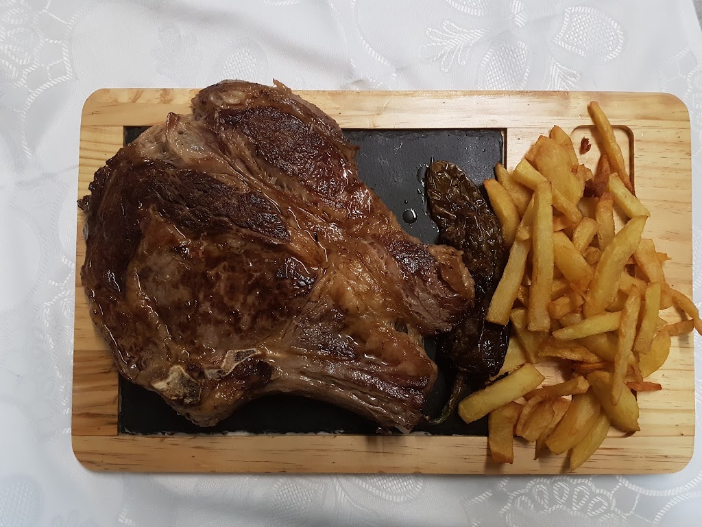 Meson Real Cortijo de San Isidro — Comida y bebida