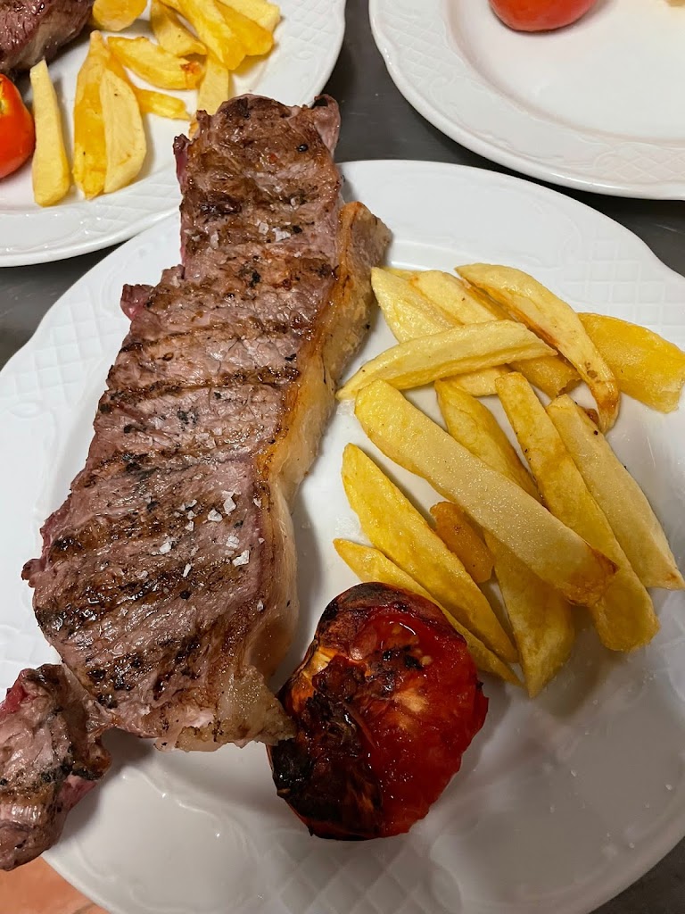 Asador Amposta (De Santi) — Comida y bebida