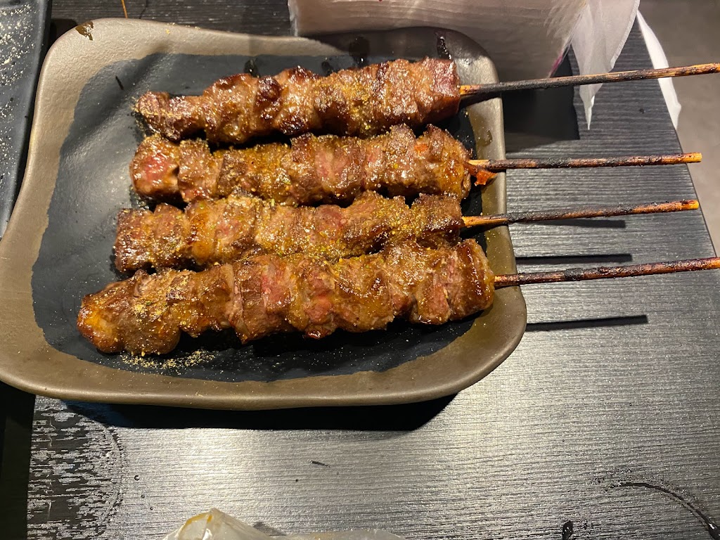 賣烤魚的。 的照片