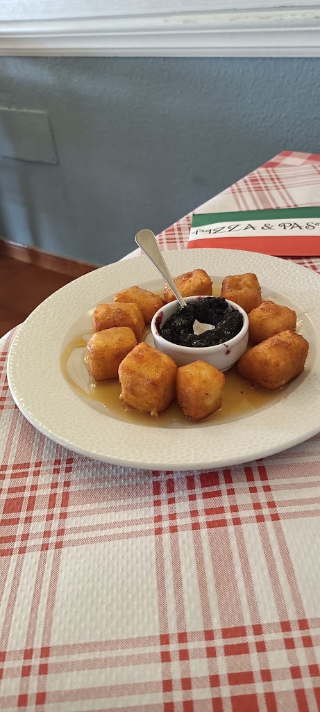 PIZZERIA EL CAPRICHO — Comida y bebida
