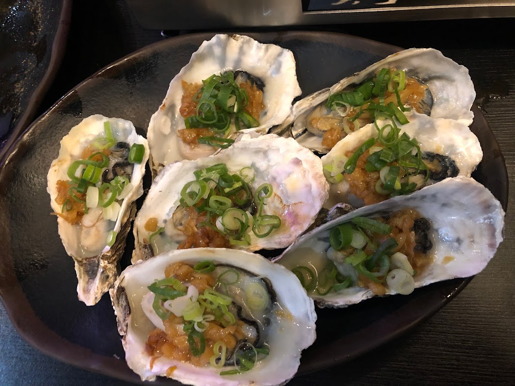 賣烤魚的。 的照片
